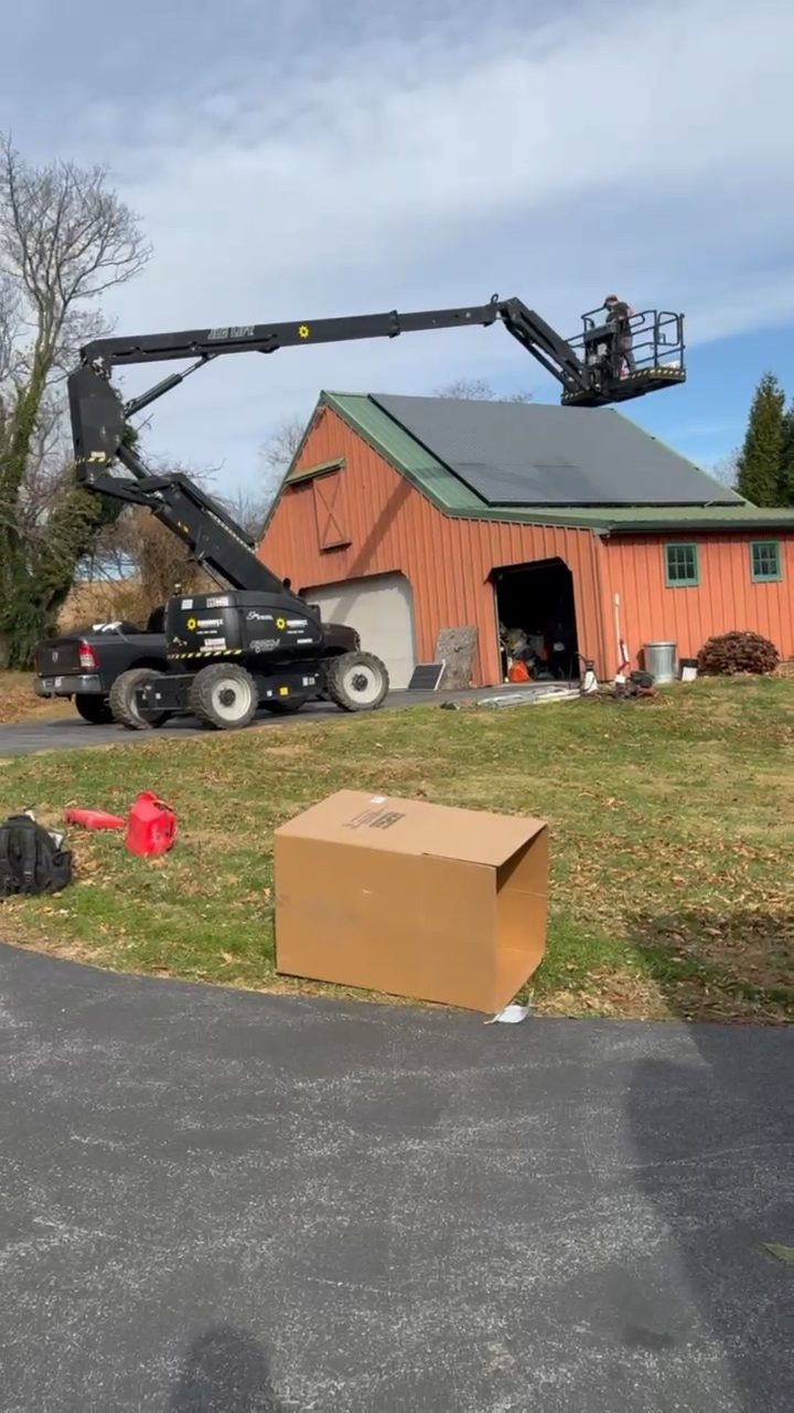 Service van and boom lift set up together on a job site