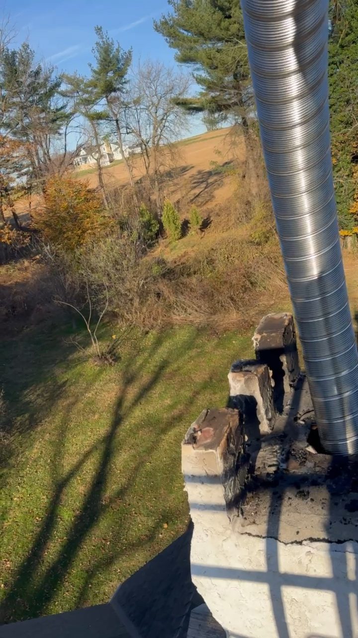 Detail of a chimney crown with a metal liner in place