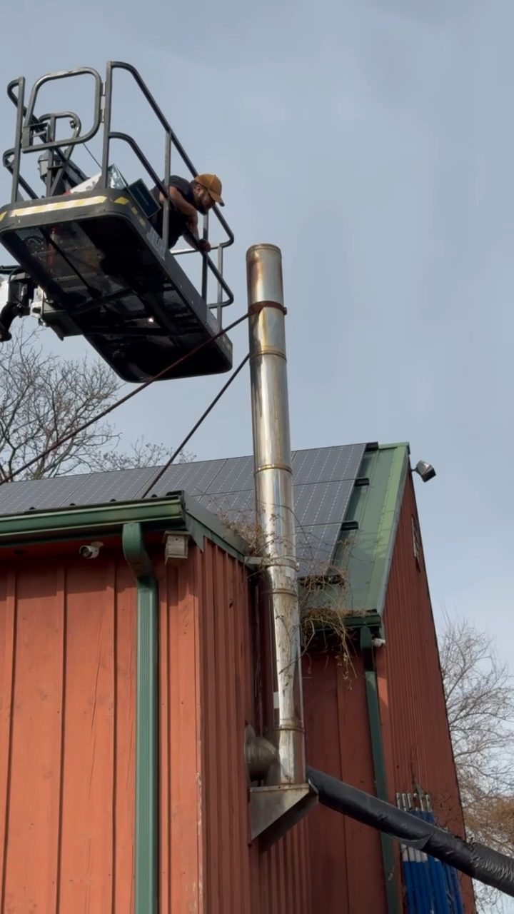 Elevated platform positioned for chimney service work