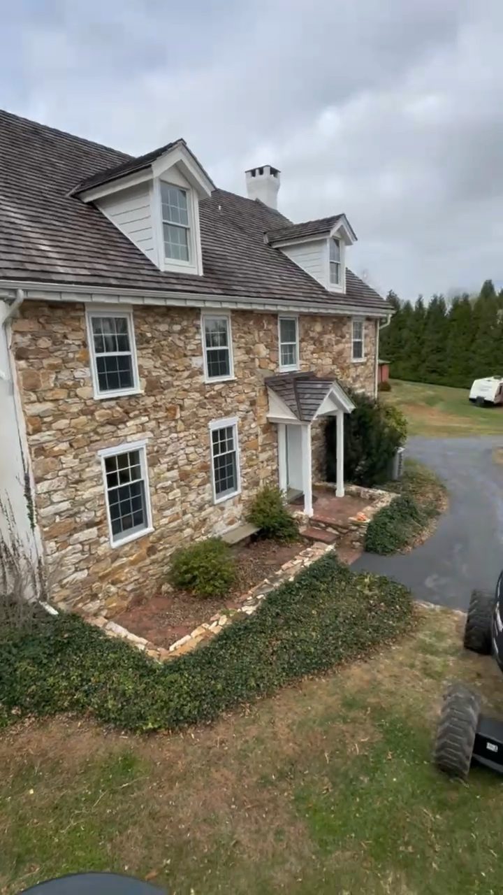 Exterior of a historic stone home served by Air Duct Dynasty