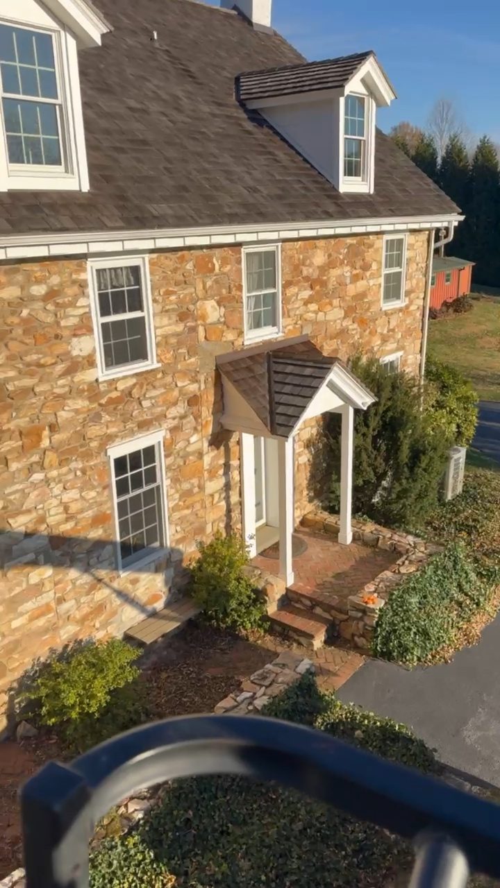 Residential stone home during a chimney service visit